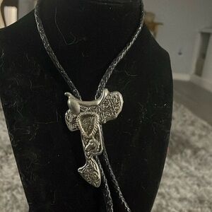 Southwestern rodeo saddle bolo tie